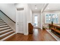 Bright foyer with hardwood floors, staircase, and plenty of natural light at 3109 W Granada St, Tampa, FL 33629
