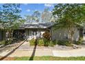 Cozy single-story home with inviting entrance and well-maintained front yard at 39650 Us Highway 19 N # 143, Tarpon Springs, FL 34689