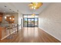 Spacious living room featuring hardwood floors, modern ceiling fans, and an open floor plan at 400 4Th S Ave # 508, St Petersburg, FL 33701