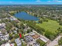 Aerial view of the home with the surrounding neighborhood, lake, and green spaces creating a scenic backdrop at 427 21St N Ave, St Petersburg, FL 33704