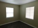 Bright bedroom with dual windows and vinyl flooring, perfect for a cozy retreat at 844 20Th S St, St Petersburg, FL 33712