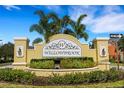 Attractive Willowbrook community entrance sign surrounded by well-maintained landscaping at 9013 White Sage Loop, Lakewood Ranch, FL 34202