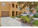 Well-maintained two-story townhome with a two car garage, manicured landscaping, and long driveway at 9013 White Sage Loop, Lakewood Ranch, FL 34202