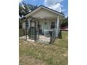 Charming single story home with a whimsical fenced courtyard entry at 11814 Washington St, Seffner, FL 33584