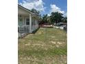 Wide view of home's fenced yard with chain link fence at 11814 Washington St, Seffner, FL 33584