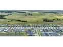 Aerial view of a residential neighborhood adjacent to vast open green space at 11847 Brighton Knoll Loop, Riverview, FL 33579
