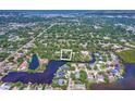 An aerial view of the property and surrounding neighborhood, with waterfront views at 1670 Fox Rd, Clearwater, FL 33764