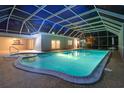 A beautiful private in-ground screened pool, with an attached spa and deck area at 1670 Fox Rd, Clearwater, FL 33764