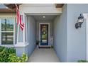 Charming entrance with a decorative wreath and an American flag adding a welcoming touch at 2781 Dolores Home Ave, Valrico, FL 33594