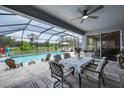 Relaxing screened-in pool with dining and lounging area overlooking the spacious backyard at 2781 Dolores Home Ave, Valrico, FL 33594