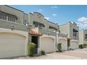 Charming townhouse with a two-car garage, elegant tile roof, and nicely manicured landscaping at 2914 W Gandy Blvd # C, Tampa, FL 33611