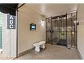Apartment building entrance featuring a secure gate, call box, and bench at 3325 Bayshore Blvd # C36, Tampa, FL 33629