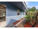 The exterior of the unit is freshly painted with new landscaping along the sidewalk at 3404 Dahlia Pl, Largo, FL 33771