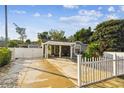 The exterior of the home features a quaint covered porch, well-maintained landscaping, and a spacious driveway at 3414 Whittier St, Tampa, FL 33619