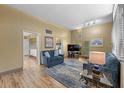 Inviting living room with hardwood floors, stylish furniture, and an open layout leading to the kitchen at 4304 N River View Ave, Tampa, FL 33607