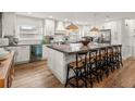 Bright kitchen featuring stainless steel appliances, a large island, and modern lighting at 4710 W Tambay Ave, Tampa, FL 33611
