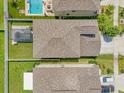 Aerial view of roof showing backyard with pool and patio at 7211 Ronnie Gardens Ct, Tampa, FL 33619