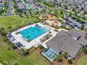 Aerial view of the community pool and recreation area, featuring a playground and clubhouse at 7211 Ronnie Gardens Ct, Tampa, FL 33619