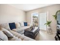 Inviting living room with plush sectional sofa and sliding door to balcony at 801 Russell Ln # 252, Brandon, FL 33510