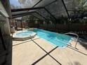 Beautiful, enclosed pool and spa features an extended, screened enclosure for year-round enjoyment at 10811 Candlin Ct, Riverview, FL 33578