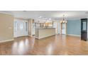 Open living area features natural light, wood floors, an open kitchen, and a bright, inviting atmosphere at 1739 Woodridge Dr, Clearwater, FL 33756