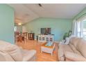 Bright living space with view to the kitchen and dining area, promoting seamless interaction at 2285 Hidden Meadows E Dr, Palm Harbor, FL 34683