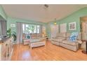 Inviting living room with ample natural light and comfortable seating arrangement at 2285 Hidden Meadows E Dr, Palm Harbor, FL 34683
