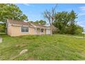 Quaint single-story home with a well-maintained lawn and ample outdoor space at 3559 Rock Royal Dr, Holiday, FL 34691