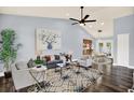 A spacious living room featuring hardwood floors, high ceilings, and an abundance of natural light at 4307 Shadberry Dr, Tampa, FL 33624