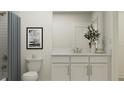 Bright bathroom with a modern vanity, sleek hardware, a marble countertop and decorative art at 4511 S Manhattan Ave # 3, Tampa, FL 33611
