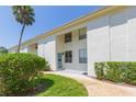 Charming exterior view of townhome with well-kept lawn and inviting entrance at 4517 La Capri Ct, Tampa, FL 33611