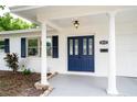 Elegant home entrance with a decorative blue double door and classic white columns at 4650 32Nd N Ave, St Petersburg, FL 33713
