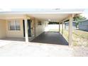 Attached carport providing covered parking and a front entry into the residence at 5417 Golden Dr, Tampa, FL 33634