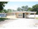 Charming single-story home featuring a covered carport and neutral-colored exterior at 5417 Golden Dr, Tampa, FL 33634