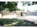 Charming single-story home featuring a covered carport and neutral-colored exterior at 5417 Golden Dr, Tampa, FL 33634
