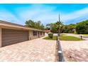 Charming single-story home with brick driveway, fenced yard and attached garage at 6423 Boxwood St, Brooksville, FL 34602