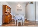 Dining room showcasing a wooden china cabinet and dining table with seating for four at 9712 White Barn Way, Riverview, FL 33569