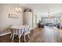Light-filled dining area featuring wood floors and a decorative chandelier at 9712 White Barn Way, Riverview, FL 33569