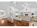 Open-concept living area with modern lighting, fireplace, and dining table, ideal for entertaining and Gathering gatherings at 1562 Coastal Pl, Dunedin, FL 34698