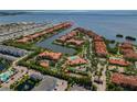 Aerial view of waterfront community with various amenities and stunning views of the intercoastal at 2773 Via Cipriani # 1310A, Clearwater, FL 33764