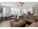 Spacious living room with tile flooring, neutral walls, and comfortable furnishings at 2773 Via Cipriani # 1310A, Clearwater, FL 33764