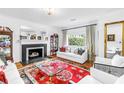 Bright living room features a fireplace, hardwood floors, and elegant furniture at 356 20Th Ne Ave, St Petersburg, FL 33704
