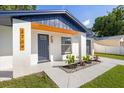 Exterior features including fresh paint, rock garden and covered entry at 3709 Danny Bryan Blvd, Tampa, FL 33619