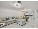 Open-concept living room and kitchen area, with modern finishes and ample natural light at 4017 Cedar Limb Ct, Tampa, FL 33614