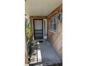 Covered front porch featuring a wood facade and a charming welcome mat at 4021 19Th N St, St Petersburg, FL 33714