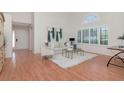 Inviting living room with hardwood floors, natural light, and stylish décor, creating a comfortable ambiance at 4234 Brentwood Park Cir, Tampa, FL 33624