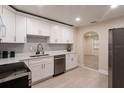 Bright kitchen featuring white cabinets, modern appliances, and an open layout at 4611 17Th N Ave, St Petersburg, FL 33713
