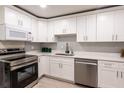 Modern kitchen featuring white cabinets, stainless steel appliances, and stylish countertops at 4611 17Th N Ave, St Petersburg, FL 33713