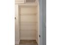Organized closet with wire shelving and tile flooring, offering ample storage space at 4611 17Th N Ave, St Petersburg, FL 33713