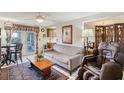 Inviting living room with tile floors, a comfortable gray sofa, and sliding glass doors at 512 Hillpine Way, Brandon, FL 33510